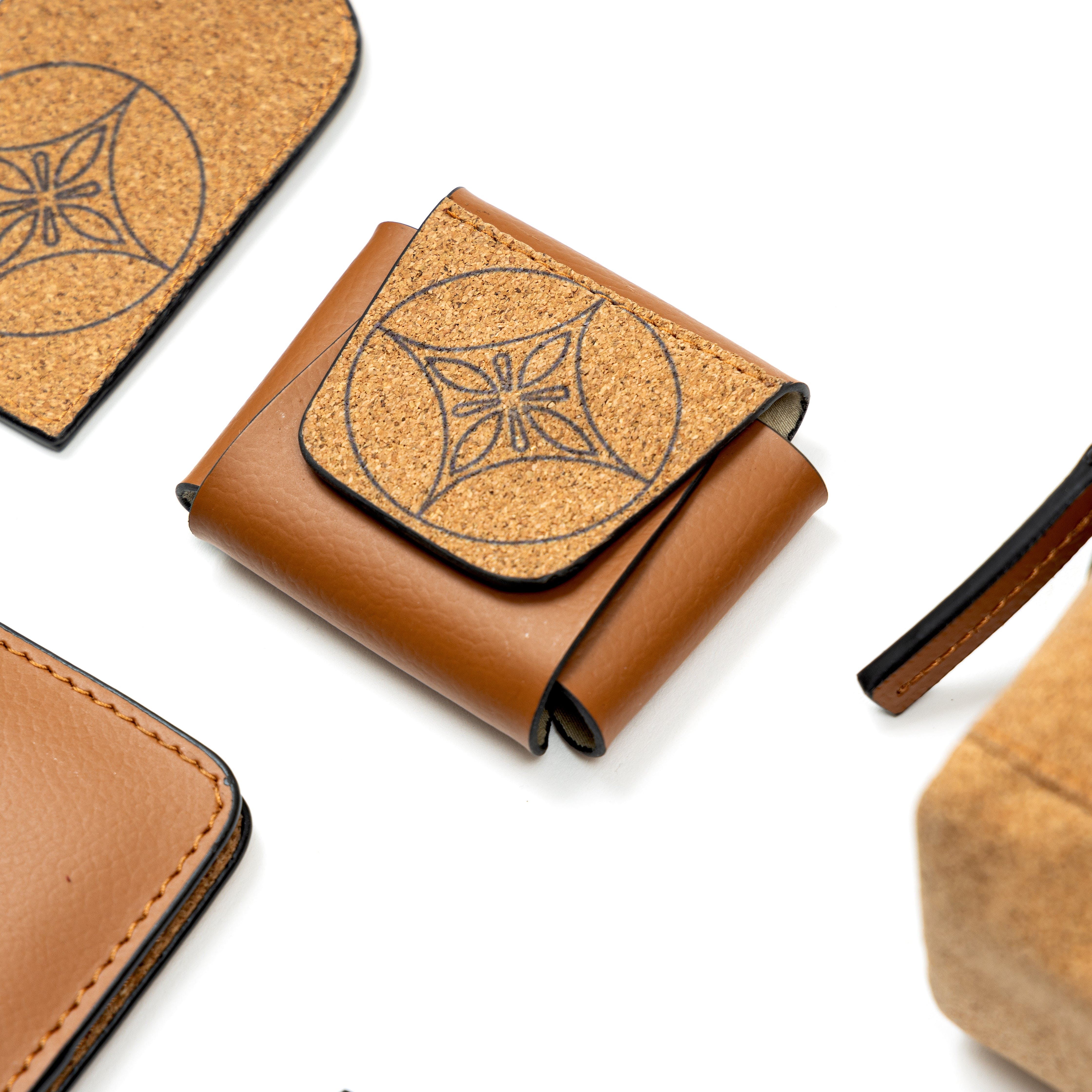 Plant leather AirPods cover from the Tan Holiday Travel Set by Green Hermitage with cork detailing and geometric motif